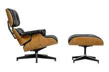 Load image into Gallery viewer, Lounge chair inspired by Eames design. Black armchair with a footrest with walnut wood. It is the latest proposal of the famous Lounge armchair in exceptionally soft leather upholstery. The entire armchair and footrest are upholstered with black natural Italian leather. 
